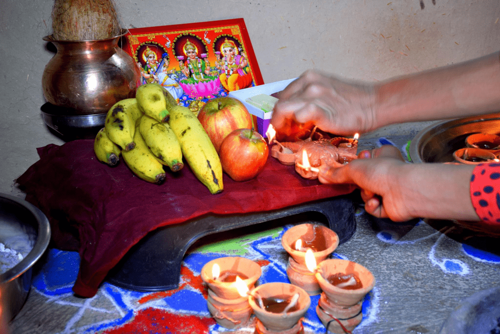 Indian family celebrating Diwali 2024 with Lakshmi Puja and decorative diyas at home