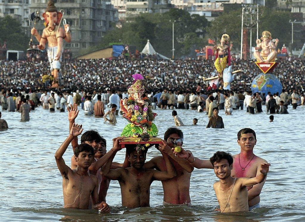 Devotees carrying a Ganesh idol for immersion during Ganesh Visarjan ceremony