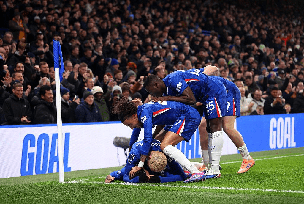 Chelsea players celebrating a comeback goal during their 3–2 win over West Ham